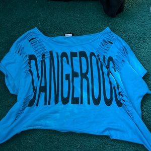 Brand is Rue 21, but got at a goodwill, color blue w/ “DANGEROUS “ in black.